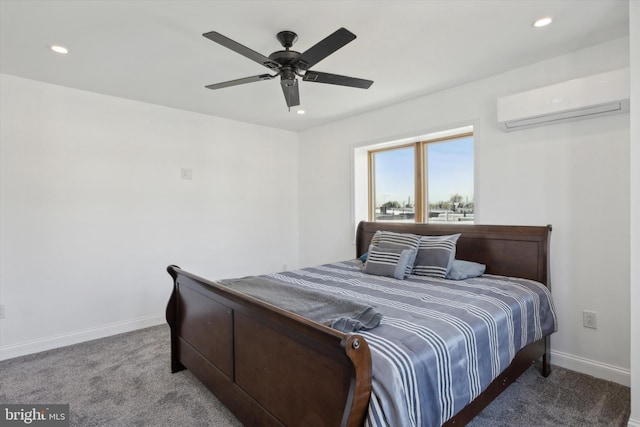 carpeted bedroom featuring a wall mounted AC and ceiling fan