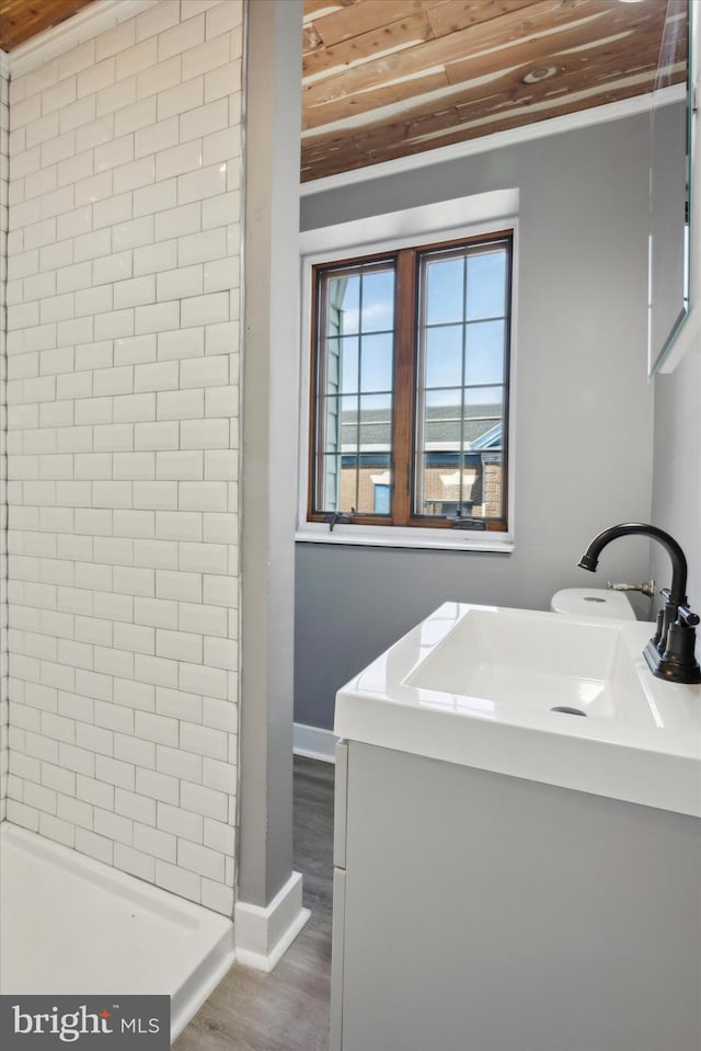 bathroom featuring crown molding, wood ceiling, vanity, and wood-type flooring