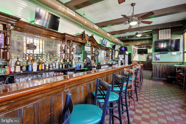 bar featuring tile floors and ceiling fan