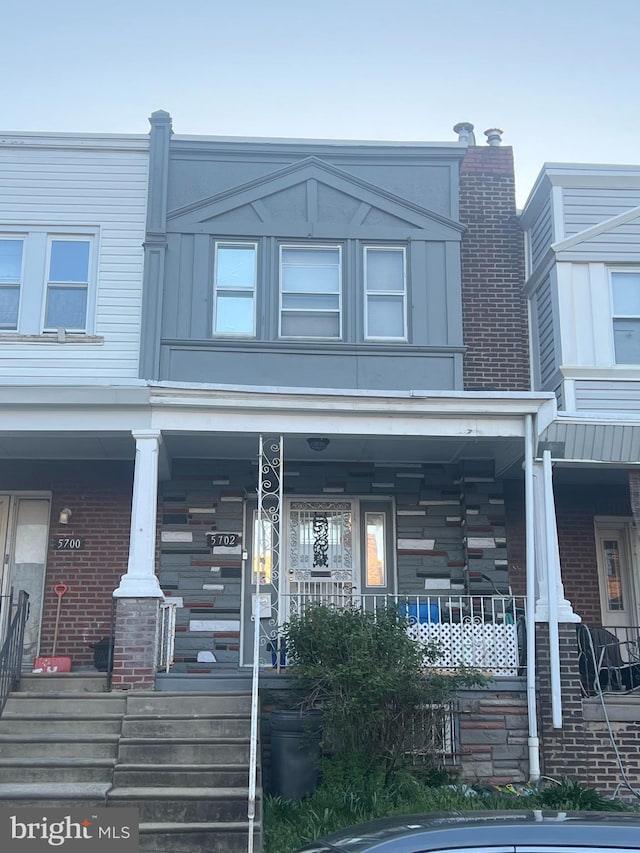 townhome / multi-family property with covered porch