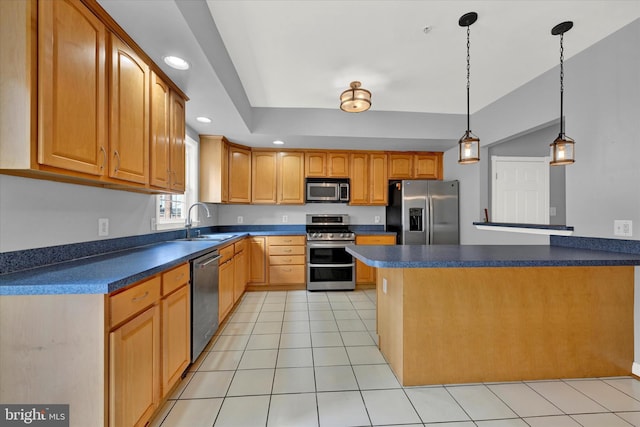 kitchen with appliances with stainless steel finishes, sink, light tile floors, and decorative light fixtures