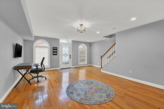 foyer featuring an inviting chandelier and light hardwood / wood-style floors