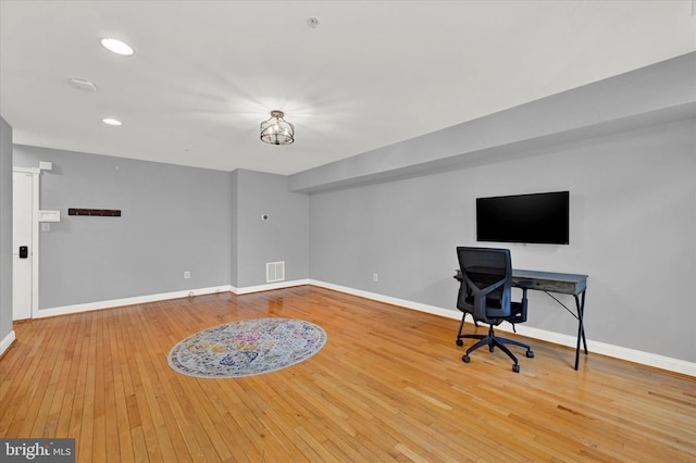 home office with light wood-type flooring