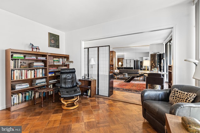 sitting room with dark parquet flooring