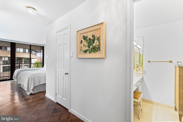 hallway featuring dark parquet floors