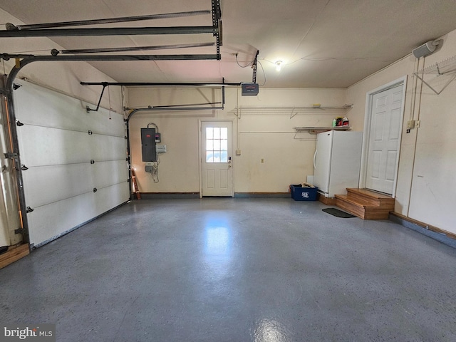 garage featuring a garage door opener and white fridge