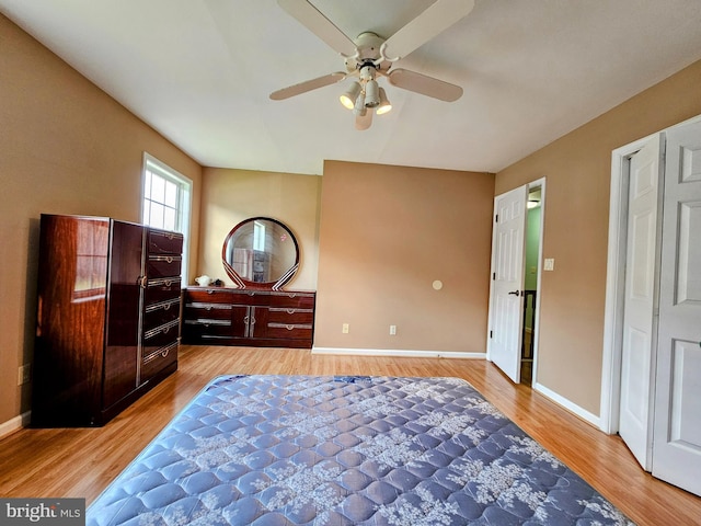 bedroom with ceiling fan and light hardwood / wood-style flooring