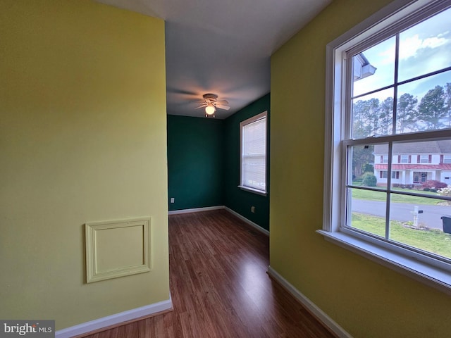 empty room with dark hardwood / wood-style floors