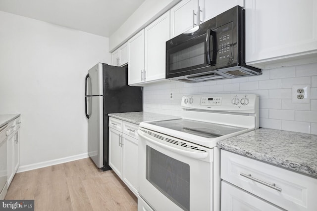 kitchen featuring light stone counters, white electric range, white cabinets, and light wood-type flooring