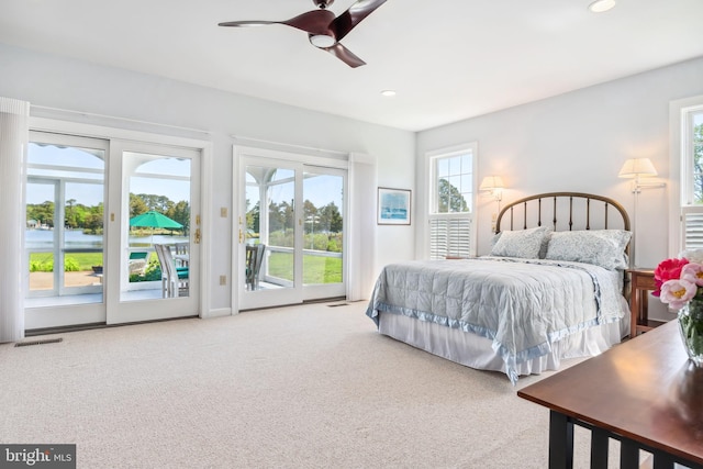 carpeted bedroom with access to outside and ceiling fan