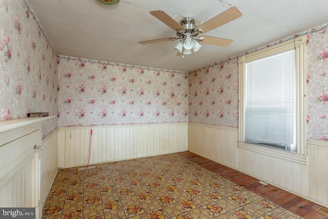 unfurnished room featuring ceiling fan and wood-type flooring