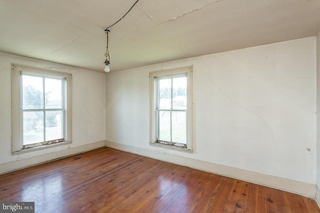 unfurnished room featuring wood-type flooring