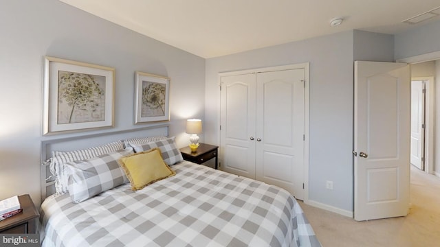 carpeted bedroom with a closet