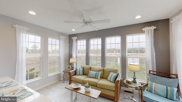 tiled living room with ceiling fan