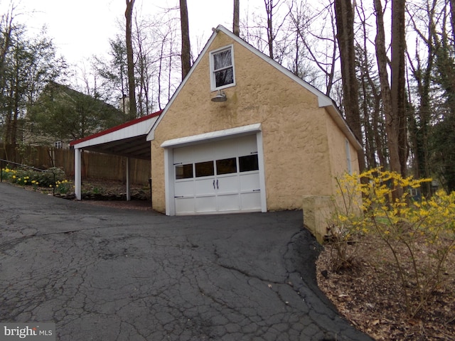 garage with a carport