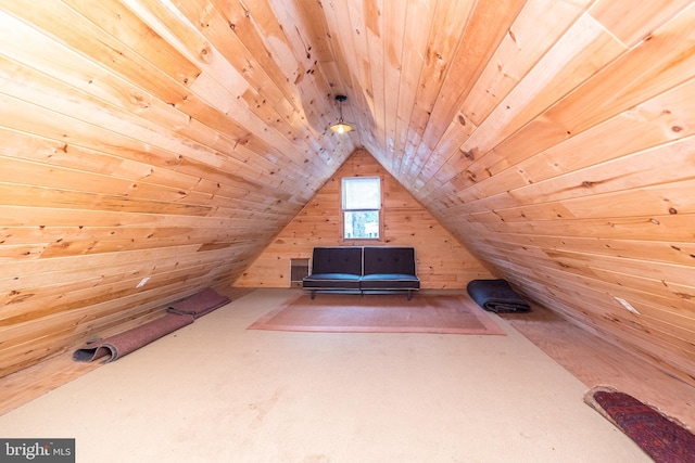 additional living space featuring wooden ceiling, wooden walls, and vaulted ceiling