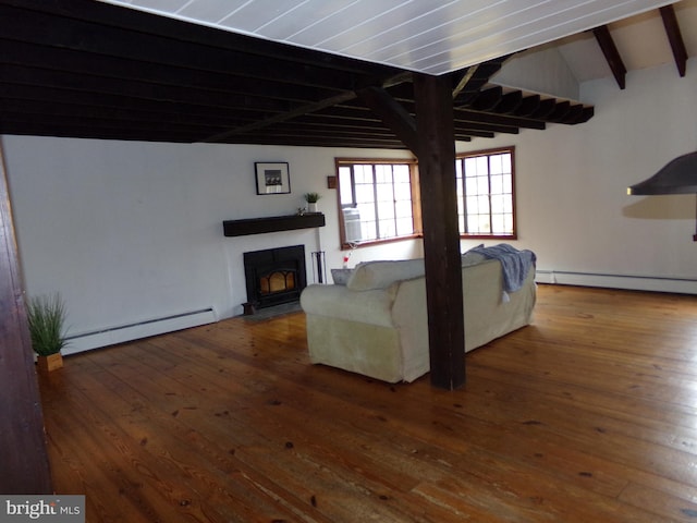 unfurnished living room with hardwood / wood-style floors, lofted ceiling with beams, and a baseboard heating unit