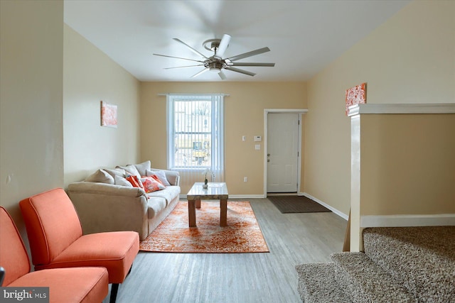 living room featuring light hardwood / wood-style floors and ceiling fan