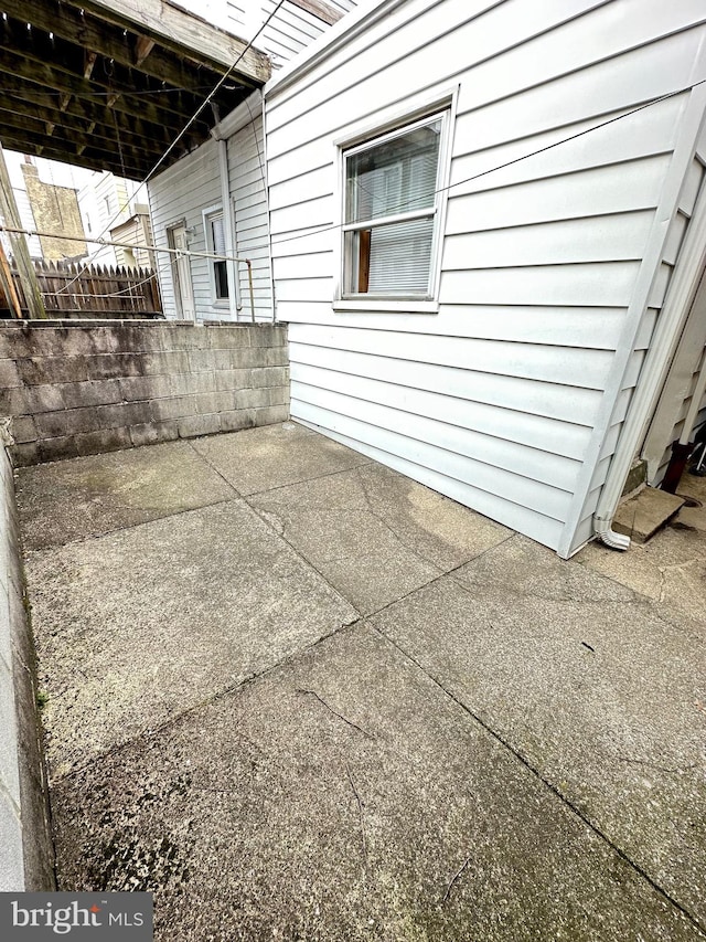 view of side of property featuring a patio area