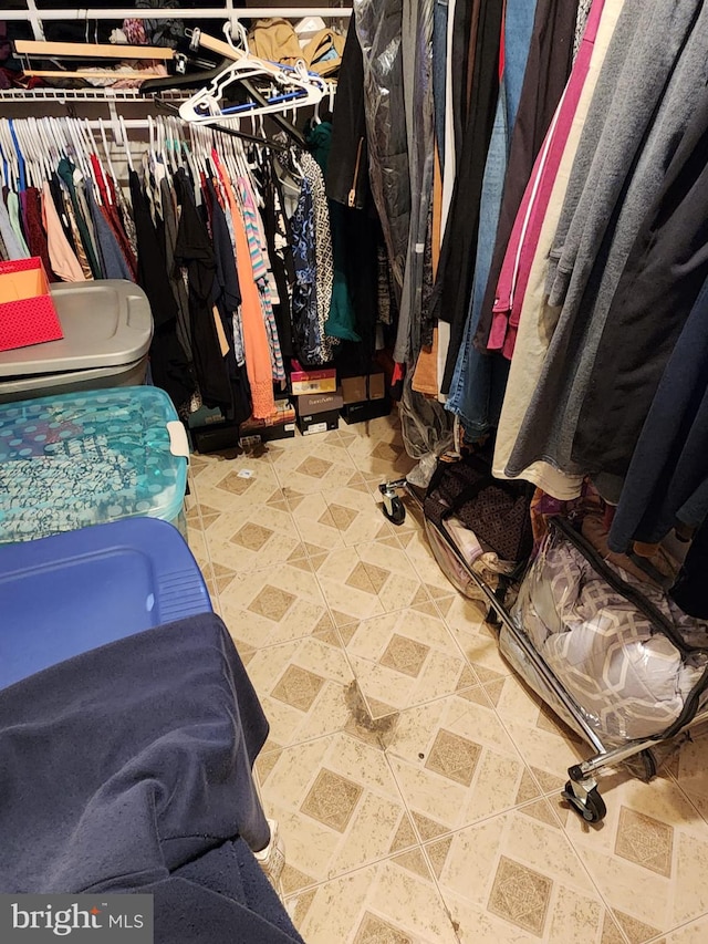 spacious closet with tile floors