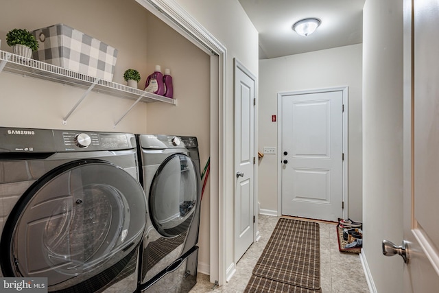 laundry room featuring separate washer and dryer and light tile flooring