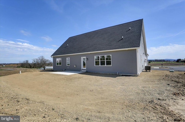 back of property with a patio and central air condition unit