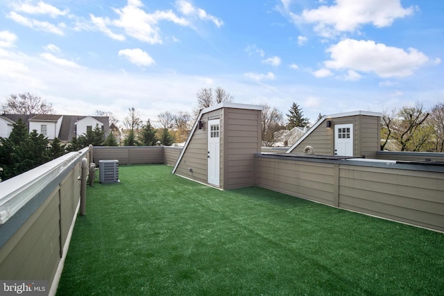 view of yard featuring central AC unit