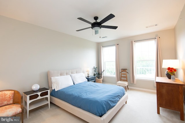 carpeted bedroom with ceiling fan