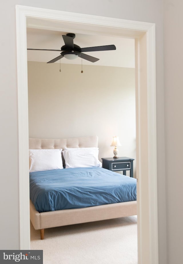 bedroom with ceiling fan and carpet flooring