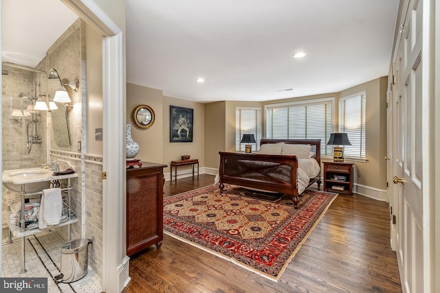 bedroom with dark wood-type flooring