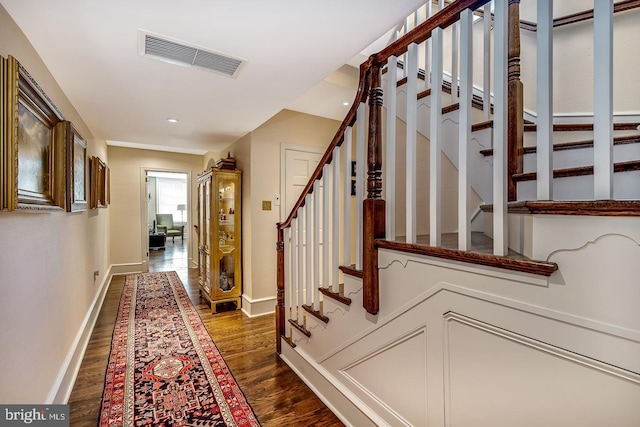 hall with dark hardwood / wood-style flooring