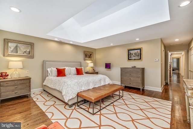 bedroom with hardwood / wood-style flooring