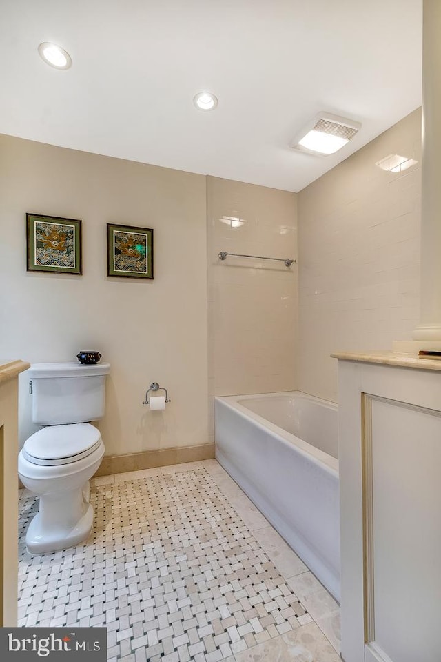 bathroom featuring vanity, toilet, and tile floors