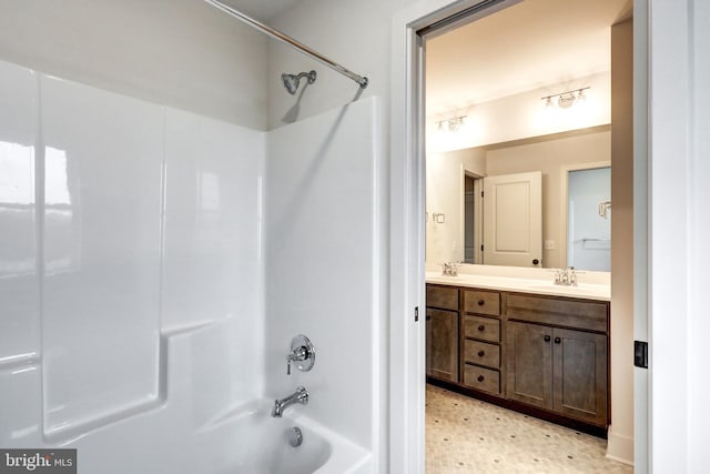 bathroom featuring large vanity, shower / tub combination, tile floors, and double sink