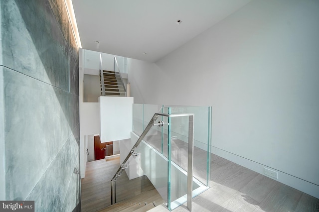 staircase with wood-type flooring