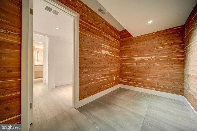 empty room with wooden walls