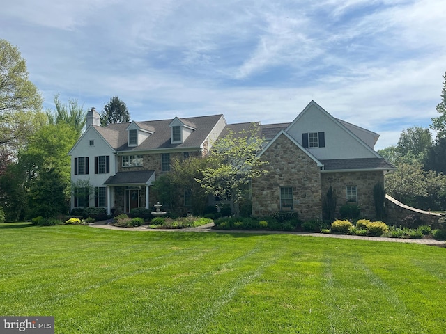 view of front of home with a front lawn