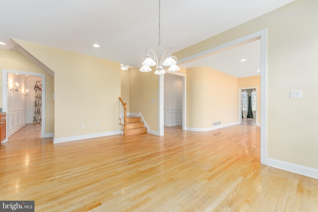 interior space with light hardwood / wood-style flooring and a chandelier