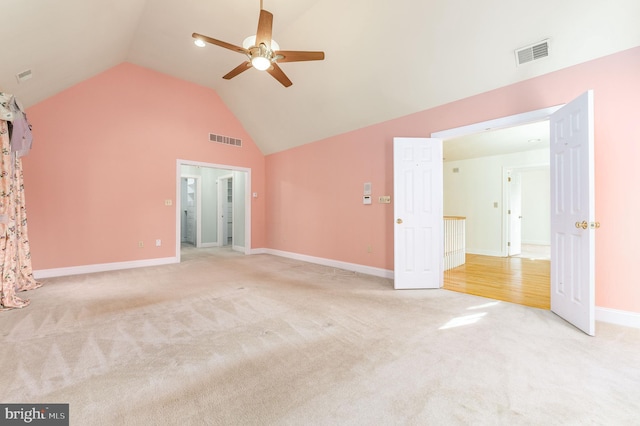 interior space featuring ceiling fan and high vaulted ceiling