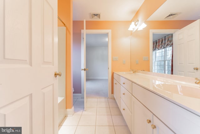 bathroom featuring tile patterned flooring and vanity