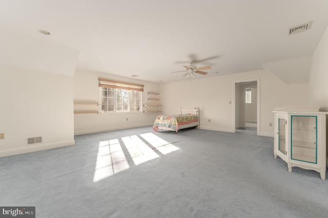 unfurnished bedroom with light colored carpet and ceiling fan