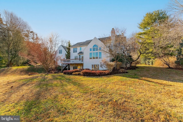 exterior space with a yard and a wooden deck