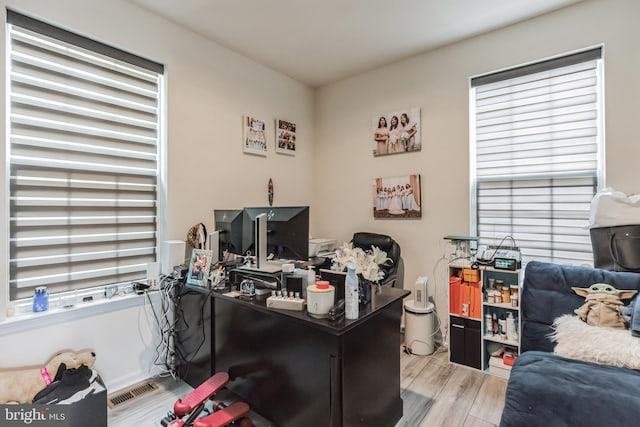 home office with light wood-type flooring