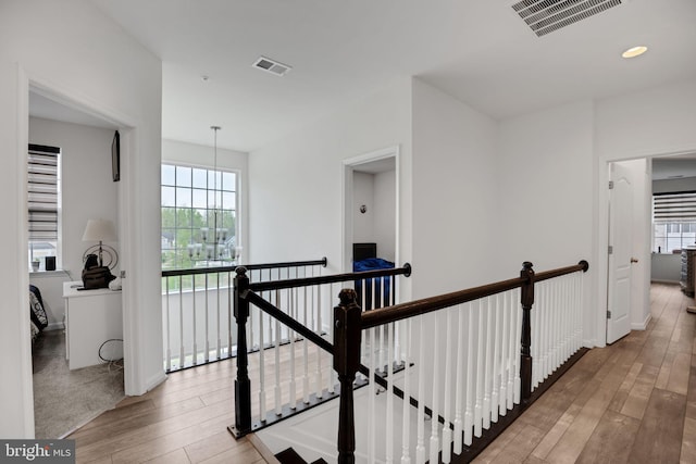 corridor with light hardwood / wood-style flooring