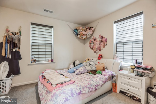 bedroom with light carpet