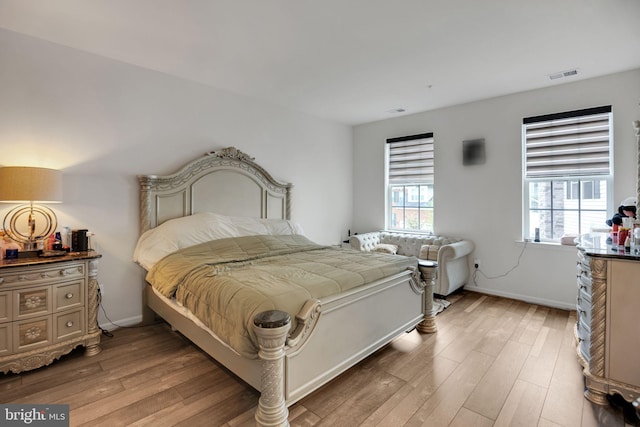 bedroom with light hardwood / wood-style flooring