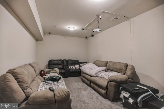 home theater room featuring light colored carpet