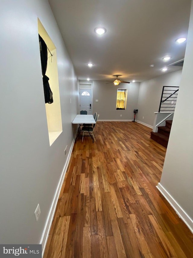 hall with dark hardwood / wood-style flooring