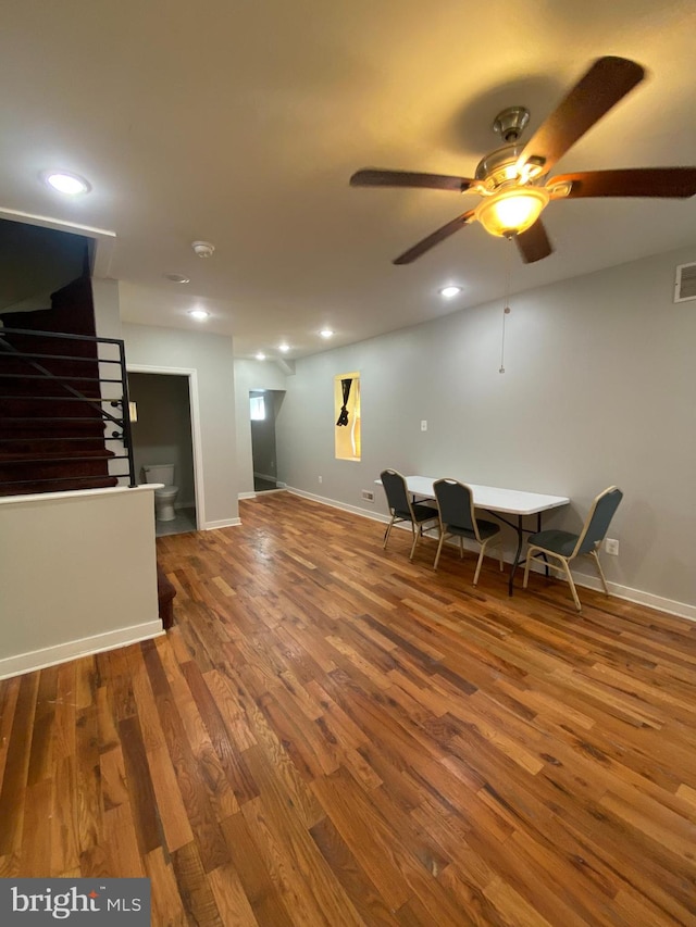 interior space with ceiling fan and dark wood-type flooring