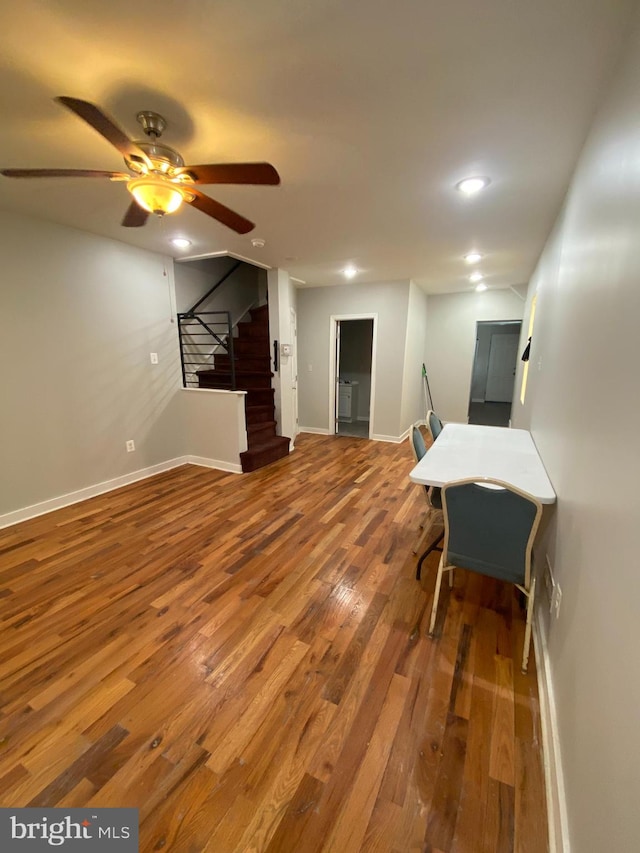 interior space with ceiling fan and hardwood / wood-style floors